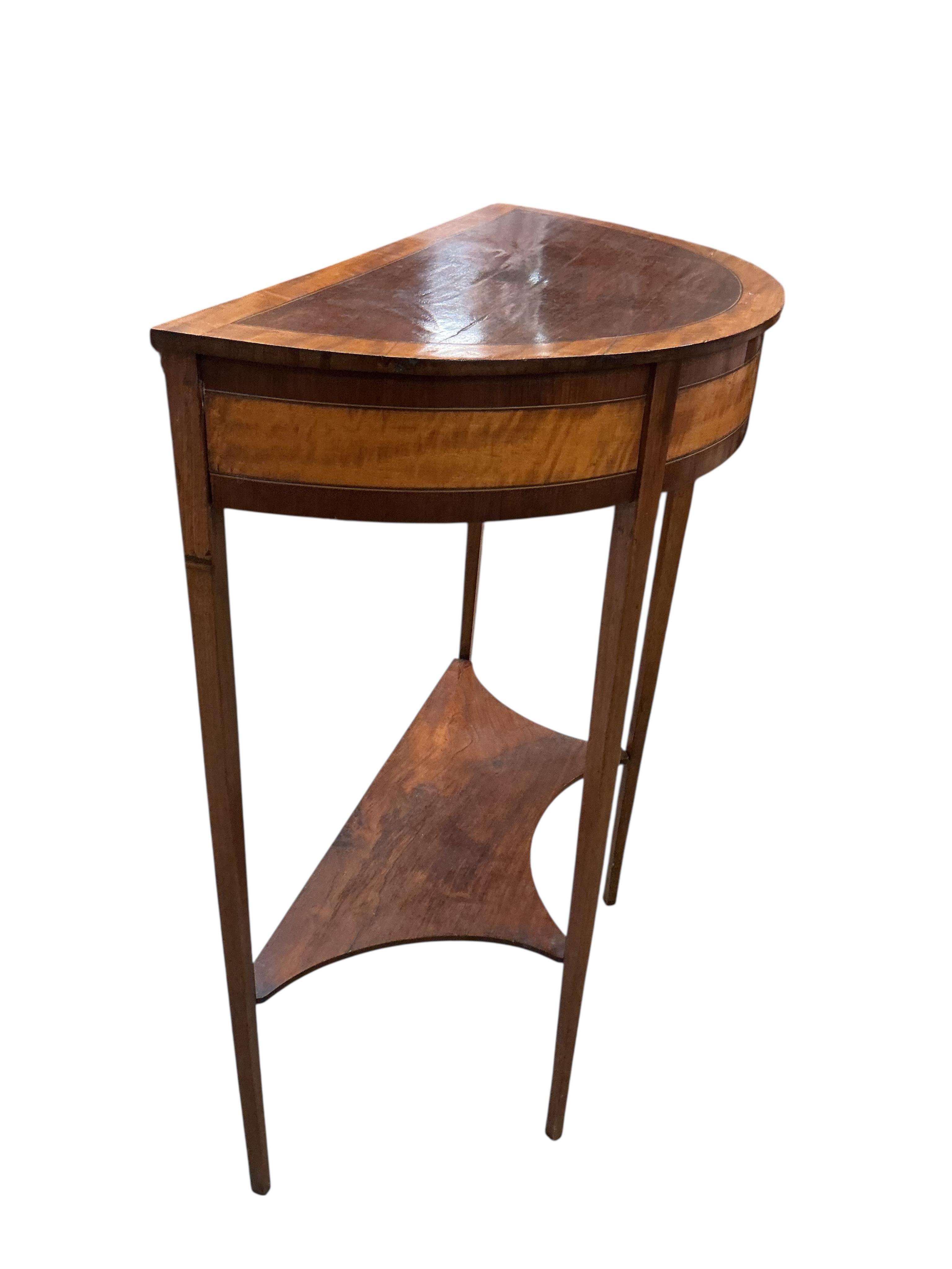 A George III style satinwood banded inlaid demi-lune two tier table, width 64cm, depth 32cm, height 77cm